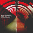Album cover for 'BLOC PARTY. - ANATOMY OF A BRIEF ROMANCE' featuring a perspective view down a red-lit tunnel with a silhouetted figure on the right and white text on the left.