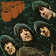 The album cover art for 'Rubber Soul' by the band The Beatles, featuring close-up portraits of the four band members against a dark green leafy background with the band's name in a large orange retro font in the top left corner.