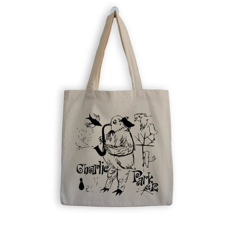 Beige tote bag with black illustration and text on a white background