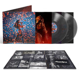 Vinyl record set with cover featuring a woman and colorful design, and additional photo album below.
