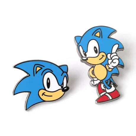 Two Sonic the Hedgehog enamel pins on a white background, one showing a close-up of Sonic's head and the other showing a full-body view of Sonic pointing upward.