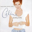 Album cover of 'Falling Into You' by Celine Dion featuring a woman holding hands with her reflection.