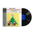 Vinyl record album for 'True Brown Christmas' by Three-Guitarz, featuring a Peanuts cover illustration with Snoopy and Charlie Brown on a black record sleeve next to a black vinyl record.