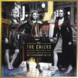 The Chicks 'Taking the Long Way' 20th Anniversary Edition album cover art, featuring the three band members posing in front of a vintage car on a cobblestone street.