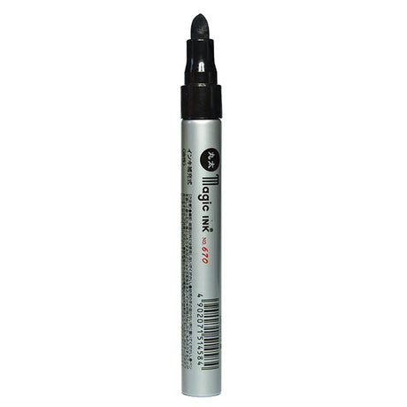 Black magic ink pen on a white background