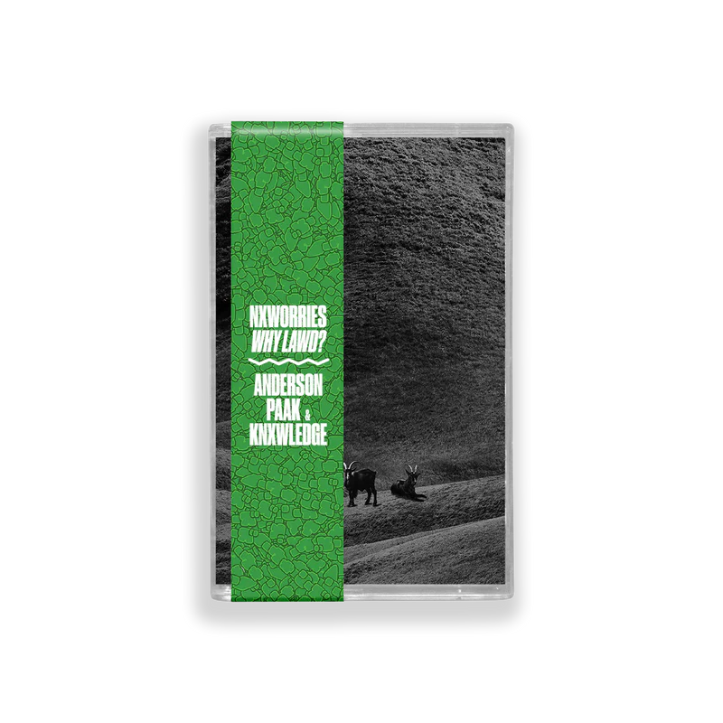 Cassette tape with green label featuring text and a black and white landscape