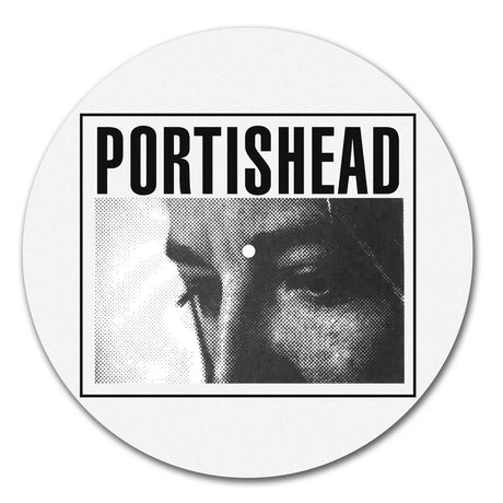 Round vinyl record with Portishead album cover featuring a black and white portrait.
