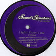 Purple record label with 'Sound Signature' branding and text