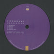 A purple vinyl record label for the music release 'Fireground Recreation' by the artist Fireground, featuring tracklist text and a small gold logo on a dark gray background.