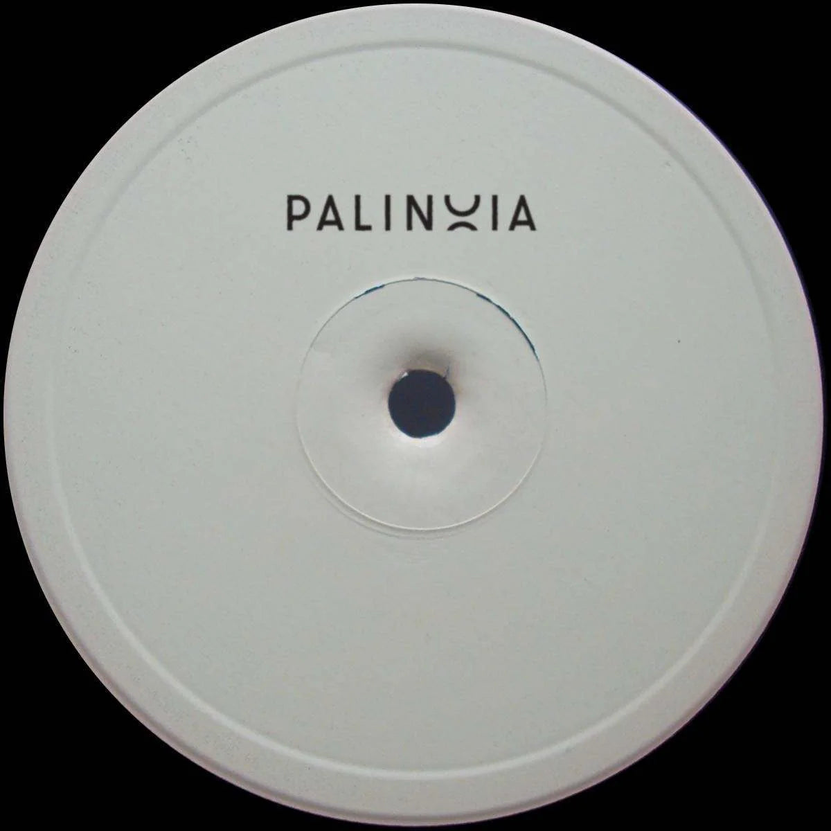 Round white object with 'PALINXIA' branding on a black background