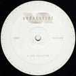 A circular vinyl record label with a white center and outer ring, featuring the text 'undacurrnt' and 'x-dub revisited' in a minimalist design against a black background.