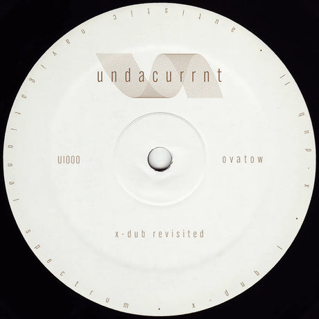A circular vinyl record label with a white center and outer ring, featuring the text 'undacurrnt' and 'x-dub revisited' in a minimalist design against a black background.