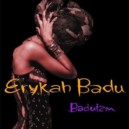 Album cover of Erykah Badu's 'Baduizm' featuring a red-toned image of Erykah Badu with her head bowed and hands covering her face. The title is prominently displayed in yellow and purple text.