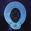 Album cover art featuring a stylized, artistic representation of a face with a blue and black color scheme and geometric patterns.