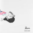 This image features the album cover for Selena Gomez's third studio album, "Rare." The cover art is minimalist, utilizing a black and white photograph of Selena Gomez in a playful, twisted pose with a colorful umbrella.