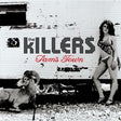 The image features a promotional photo of The Killers' album 'Sam's Town' with a backdrop that includes a rustic, weathered structure and a ram. The band's name is displayed in a stylized font, and the album title 'Sam's Town' is shown in large, bold letters below the band's name.