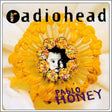 Radiohead - Pablo Honey LP cover featuring a close-up of a child's face with multicolored flowers in the background, indicating a vibrant and possibly psychedelic influence.