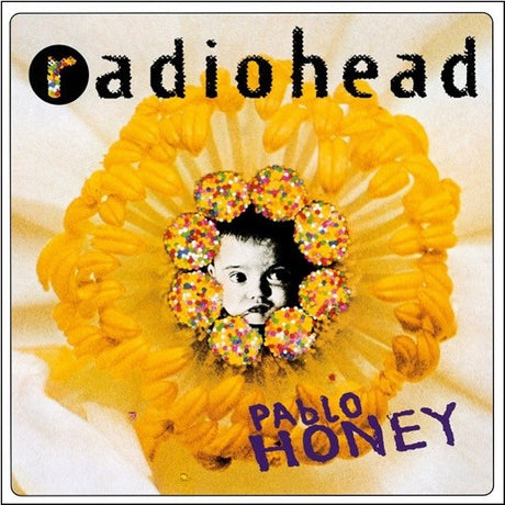 Radiohead - Pablo Honey LP cover featuring a close-up of a child's face with multicolored flowers in the background, indicating a vibrant and possibly psychedelic influence.