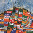 Album cover art for Radiohead's Hail To The Thief featuring a colorful collage of text.