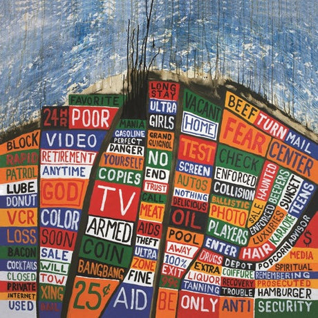 Album cover art for Radiohead's Hail To The Thief featuring a colorful collage of text.