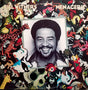 Album cover of 'Menagerie' by Bill Withers featuring a black and white photograph of Bill Withers surrounded by colorful animal illustrations.