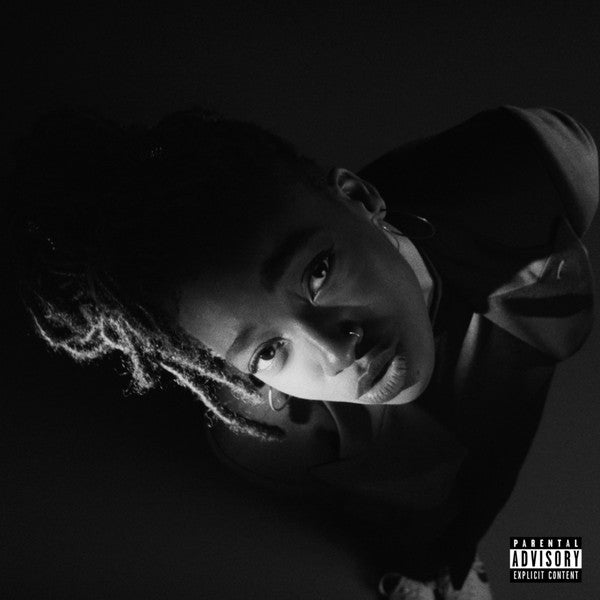 This image features the cover art for the album "Little Simz - Grey Area LP (White Vinyl)." It shows a close-up portrait of the artist, Little Simz, in a thoughtful and contemplative pose.