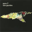 Album cover art for Zero 7 - The Garden, featuring a collage of various images including plants and possibly a face.