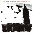 Album cover for The War On Drugs - Wagonwheel Blues featuring a black and white photograph of a castle with silhouetted birds flying around it.