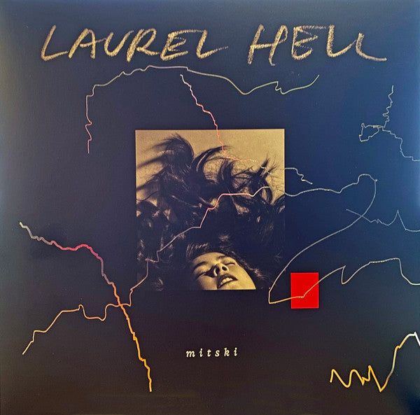 Album cover for Mitski's Laurel Hell featuring a stylized illustration with a person's hair in a dynamic pose, with lines suggesting movement or electricity around it. The title 'LAUREL HELL' is in bold white letters at the top, and the artist's name 'mitski' is at the bottom, with a small red square on the right side.