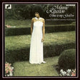 Album cover of Minnie Ripperton - Come Into My Garden LP featuring Minnie Ripperton in a white dress standing in a garden.