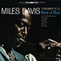 Miles Davis - Kind Of Blue album cover featuring a black and white photograph of Miles Davis playing a trumpet.