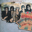 Album cover of 'Traveling Wilburys - Volume One LP' featuring a collage of photos with five members of the band The Traveling Wilburys.