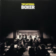 Album cover for The National's Boxer LP featuring a black and white photograph of the band performing on stage.