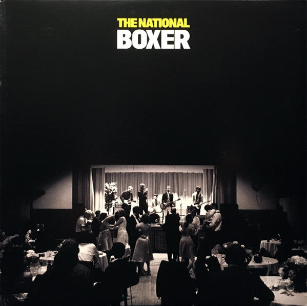 Album cover for The National's Boxer LP featuring a black and white photograph of the band performing on stage.