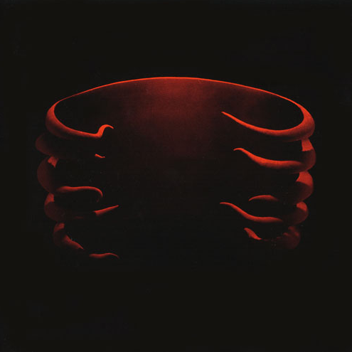 Album cover art for Tool - Undertow LP showing a red-toned, abstract image of hands or fingers against a dark background.