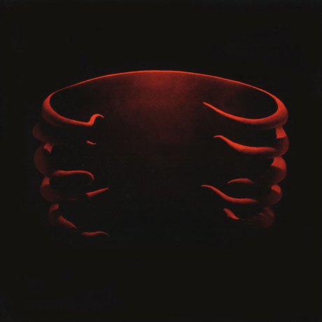 Album cover art for Tool - Undertow LP showing a red-toned, abstract image of hands or fingers against a dark background.