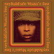 Album cover for Erykah Badu's 'Mama's Gun' featuring a photo of Erykah Badu in a hat with a reddish-orange color scheme.