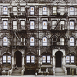 The album cover of Led Zeppelin's 'Physical Graffiti' featuring a black and white photograph of a building with 'LED ZEPPELIN' written across the windows.
