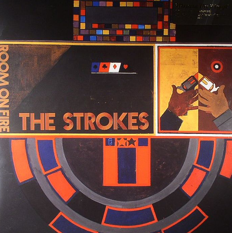 Album cover for The Strokes - Room On Fire LP with artwork featuring geometric shapes and the band's name.