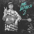 Black and white album cover featuring Mac DeMarco holding a guitar, making a peace sign, with the album title 'Mac DeMarco 2' above.