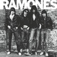 Black and white album cover featuring the band Ramones standing in front of a graffiti-covered wall.
