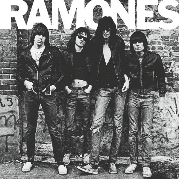 Black and white album cover featuring the band Ramones standing in front of a graffiti-covered wall.