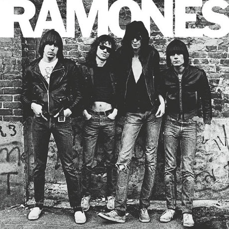 Black and white album cover featuring the band Ramones standing in front of a graffiti-covered wall.
