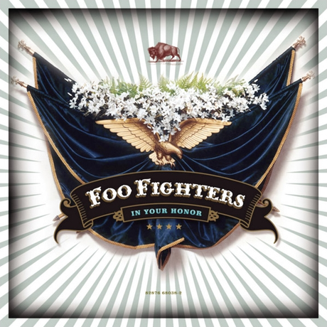  Foo Fighters album cover for 'In Your Honor' featuring a graphic design with an eagle, flowers, and the band's name.